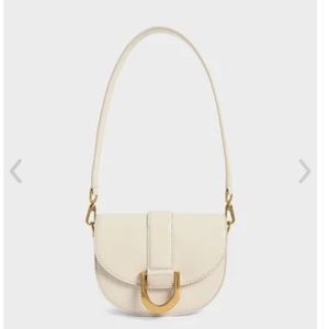 Charles & Keith Mini Gabine Saddle Bag - Cream